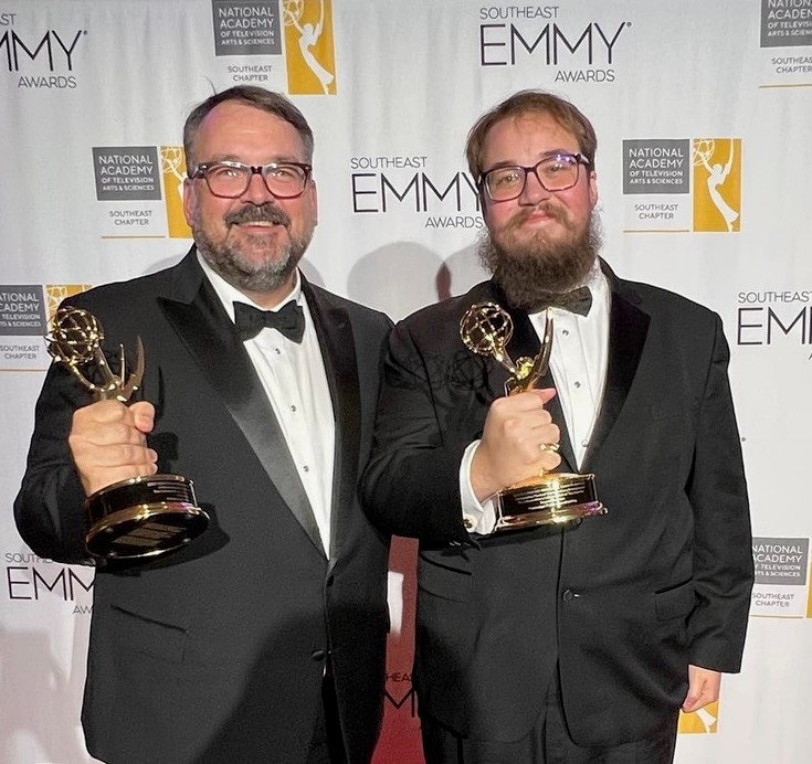 Anthony Thaxton, left, and his son, Bryant, display the Southeast Emmy Awards they received from the National Academy of Television Arts and Sciences June 18 in Atlanta.