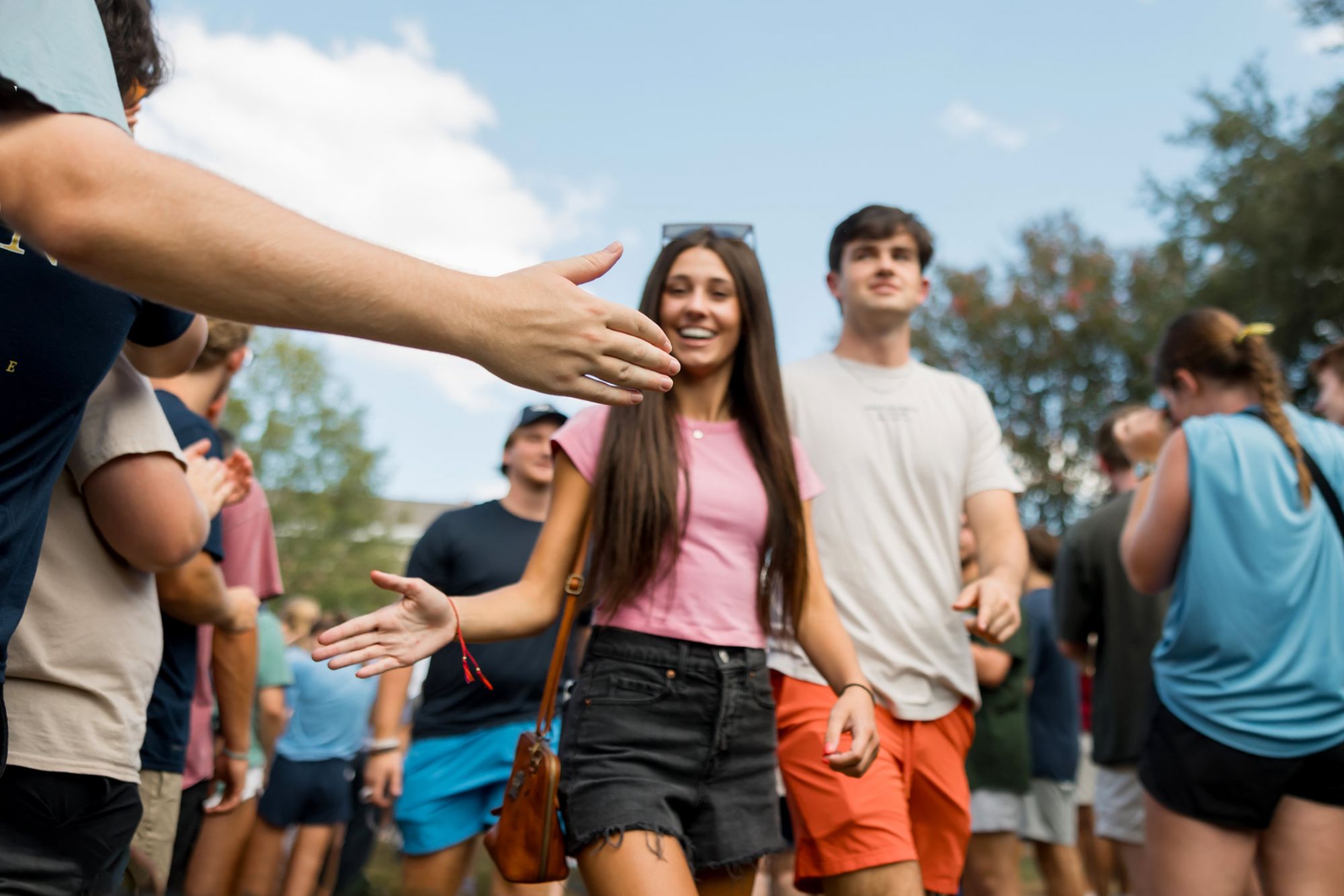 MC Student Smiling and Welcoming Each Other at an Event