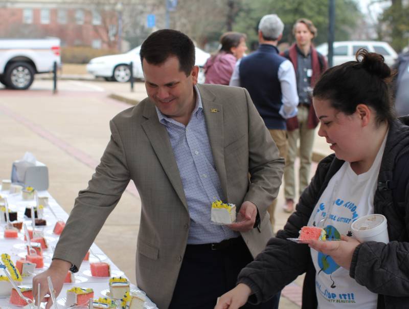 MC President Blake Thompson selects a piece of cake while celebrating Founders Day 2022 with faculty, staff, and students on Pedestrian Street. This year, alumni and friends of MC can join the festivities from afar by participating in “A Day of Giving on Founder’s Day.”