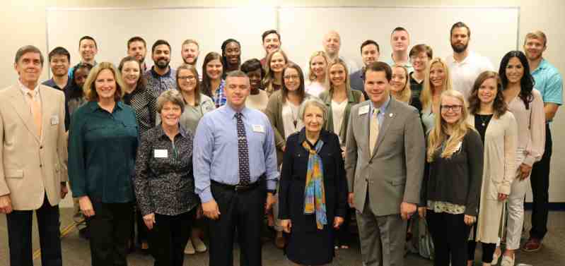 President Blake Thompson welcomes Dr. Rebekah Naylor to the Clinton campus. He joins with PA students and leaders for a group picture.