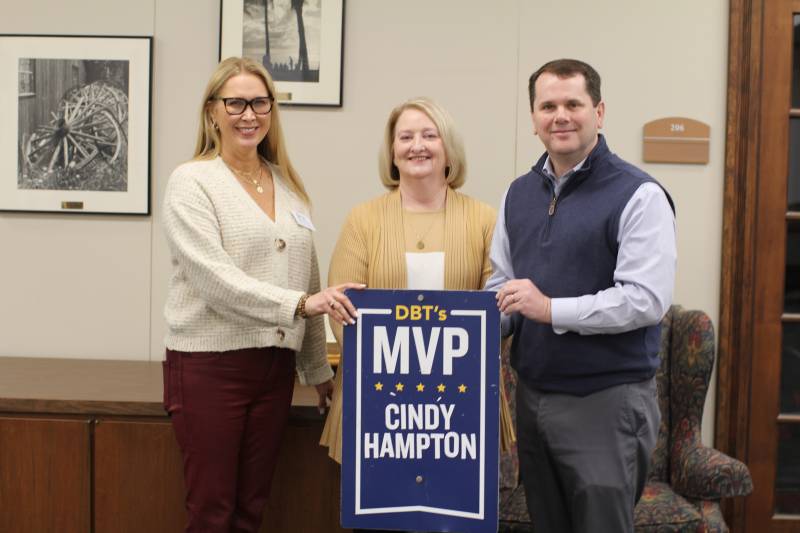 MC President Blake Thompson and Stephanie Word, left, the last DBT's MVP recipient, present the award to Cindy Hampton, IT systems analyst.