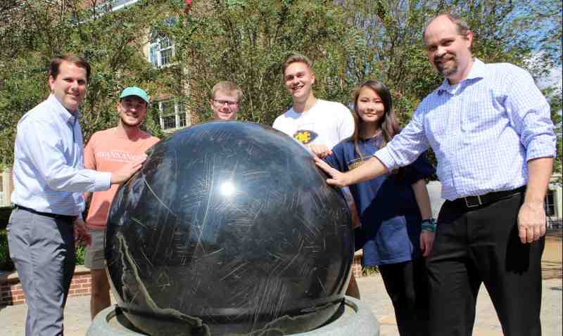 President Blake Thompson joins students and professor Chris Maggio excited about Mississippi College's electrical engineering program gaining ABET accreditation. 