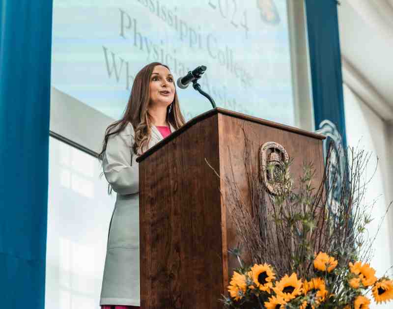 Courtney C. Wright, a graduate of MC's Physician Assistant Studies Program, addresses this year's white coat recipients during the Physician Assistant Studies’ 12th White Coat Ceremony Sept. 1 in Anderson Hall in the B.C. Rogers Student Center.