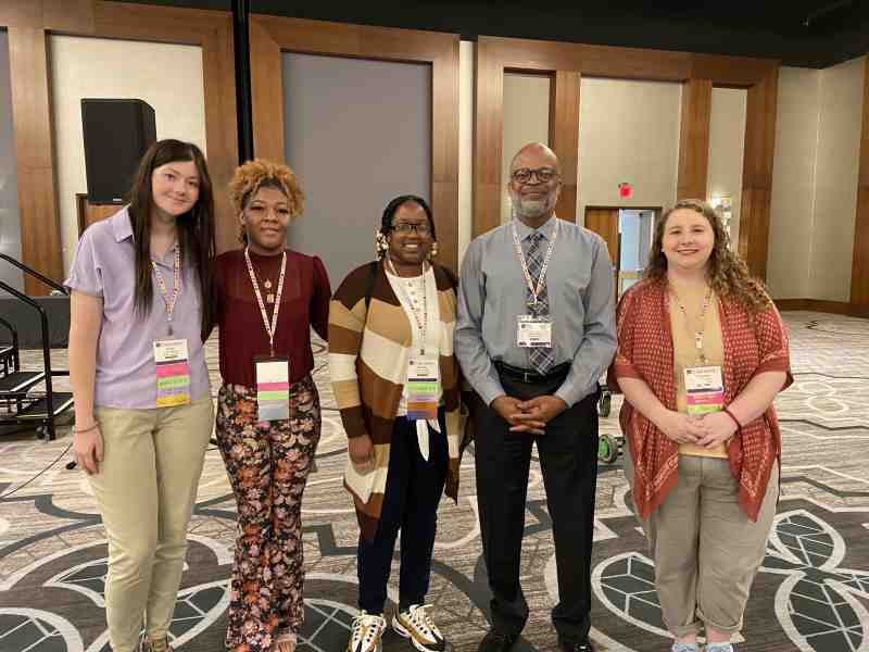 Brittany Bradley, center, visits with fellow 2023 NAEA National Convention meeting attendees in San Antonio, Texas, from left, Emily Pearson, MC senior art education student from Madison, Logan Hudson, MC senior art education student from Pearl, James Haywood Rolling Jr., NAEA past president, and Cameron Huey, MC art education graduate.