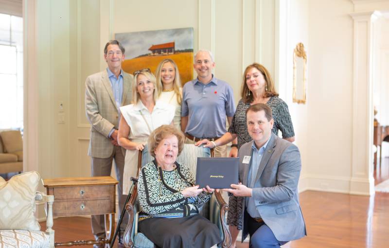 Witnessing MC President Blake Thompson presenting Rev. Barney Walker’s diploma to his daughter, Valma Walker Miller, are Walker’s family members, from left, Lee Miller, Walker’s grandson; Susan Weir, Walker’s great-granddaughter-in-law; Lucy Weir, Walker’s great great granddaughter; Trey Weir, Walker’s great-grandson; and Carol Holly, Walker’s granddaughter.