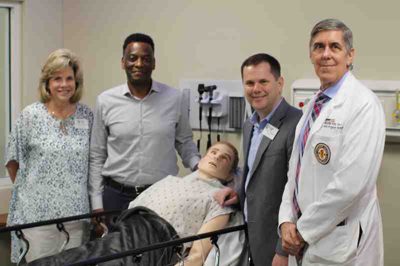 Dr. Steve Martin, right, showcases the state-of-the-art Laerdal SimMan 3G Plus advanced patient simulator for MC administrators, from left, Laura Jackson, MC chief operating officer and chief financial officer, Dr. Keith Elder, MC provost and executive vice president, and Dr. Blake Thompson, MC president.