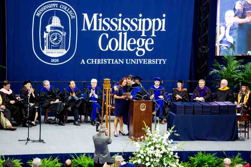 Shelia Carpenter receives the Doc Quick Distinguished Staff Award at recent commencement ceremony.