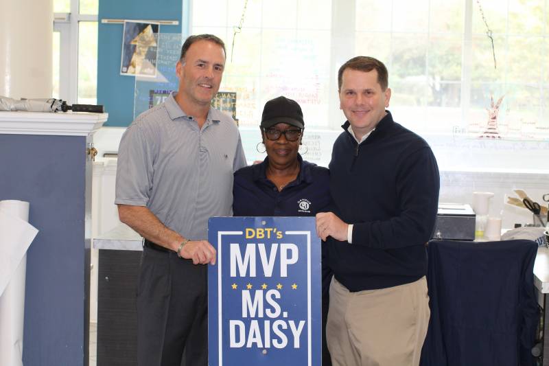 While presenting his DBT's MVP Award to Daisy Harrell, MC President Blake Thompson, right, recognized her 50 years of remarkable service to the University. Mike Prince, left, president of campus dining, says Harrell has been a 