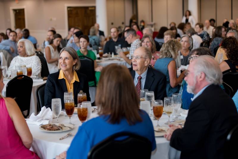 Mississippi College faculty and staff members celebrate the beginning of another academic season and enjoy hearty fellowship during last year's Convocation meal in Anderson Hall.