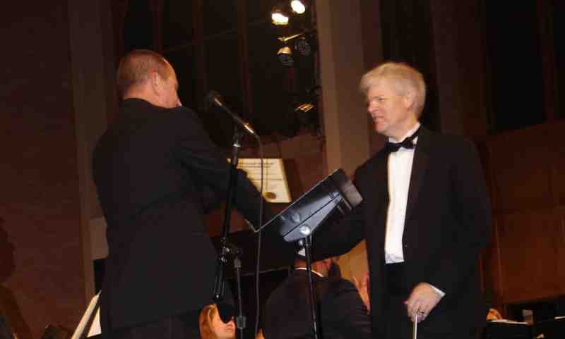 Dr. Craig Young, right, receives the National Band Association Citation of Excellence from his former pupil, Dr. Casey Kirk.